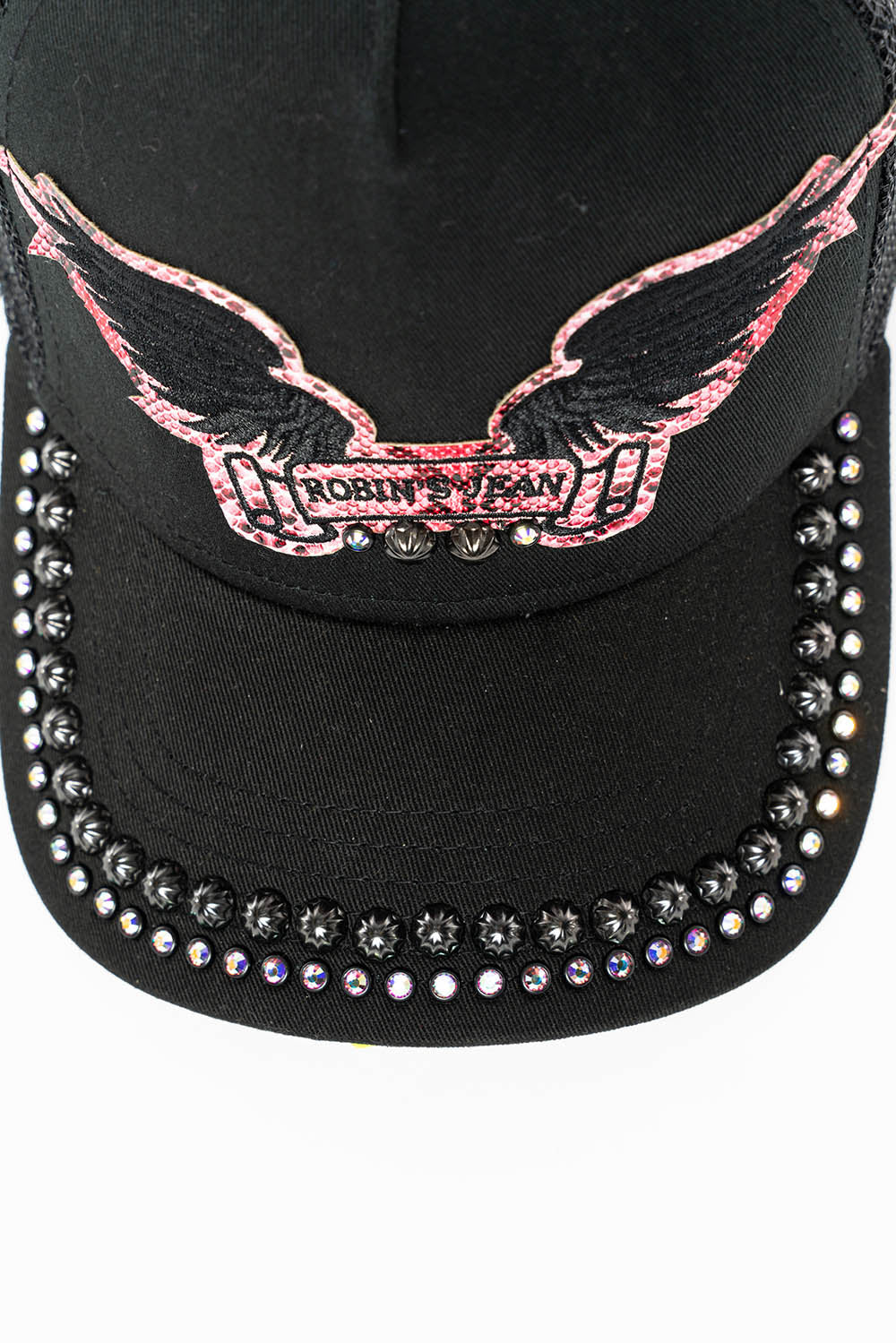 BLACK TRUCKER HAT WITH ROBIN’S SIGNATURE WING LOGO IN SALMON PYTHON WITH STUDS AND CRYSTALS