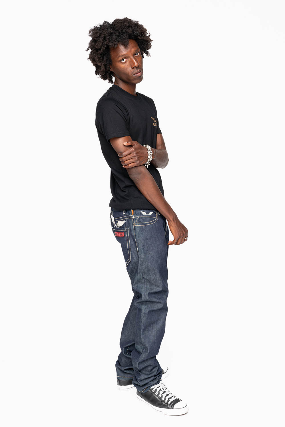 ROBIN’S BRITISH FLAG SLIM JEANS IN RAW DENIM EMBROIDERED ROBIN”S WING LOGO ON THE BACK WITH PATCHES