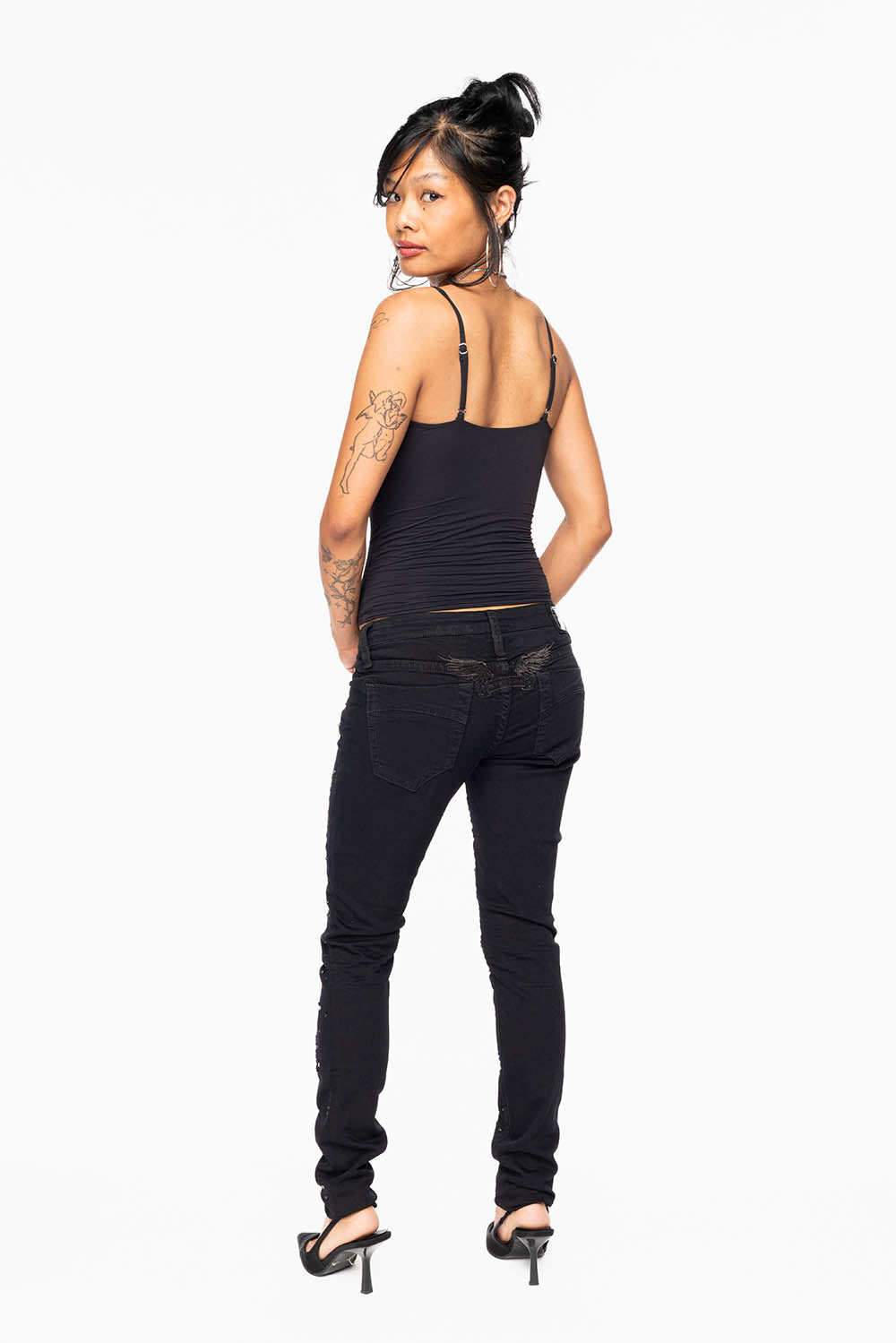 MARILYN WOMENS SKINNY JEANS IN REPAIRED PURE BLACK WITH TONAL WINGS EMBELLISHED WITH CRYSTALS & STUDS