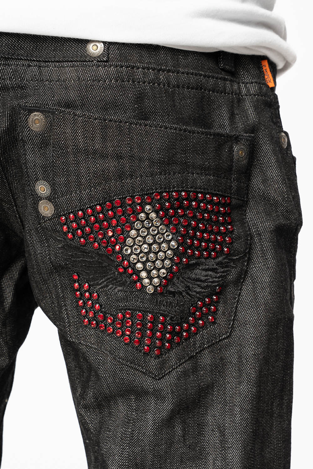ROBIN’S BOOT CUT JEAN IN RAW BLK DENIM WITH WITH EMBROIDERED WING LOGO ON BACK POCKETS WITH CRYSTALS