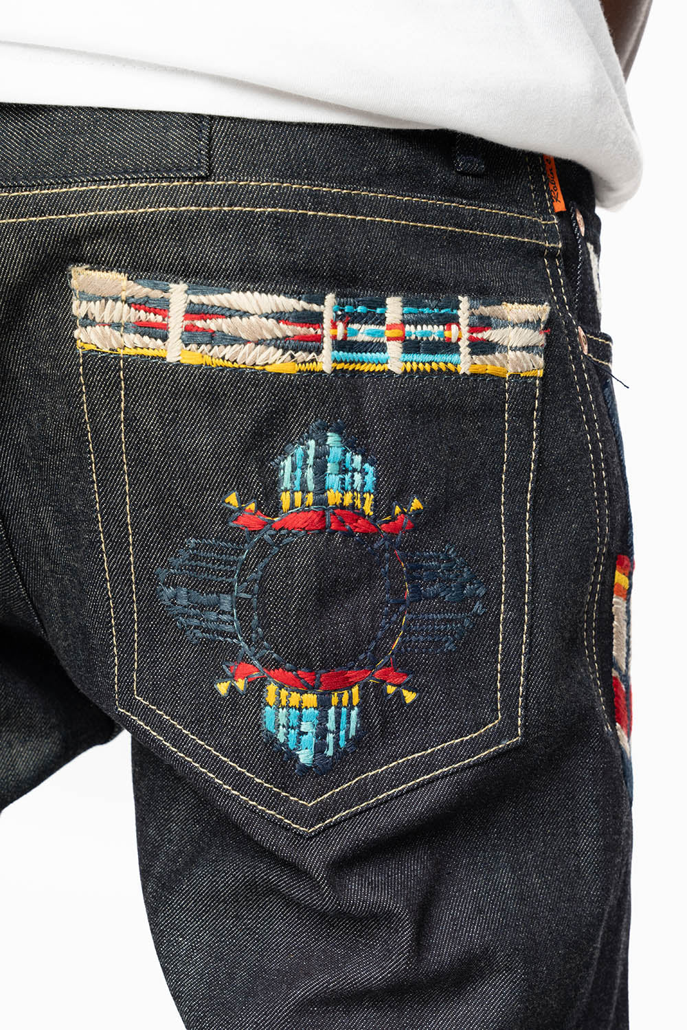 ROBIN’S INDIAN BONE STRIPE SLIM JEANS IN RAW DENIM EMBROIDERED INDIAN TRIBE MOTIF