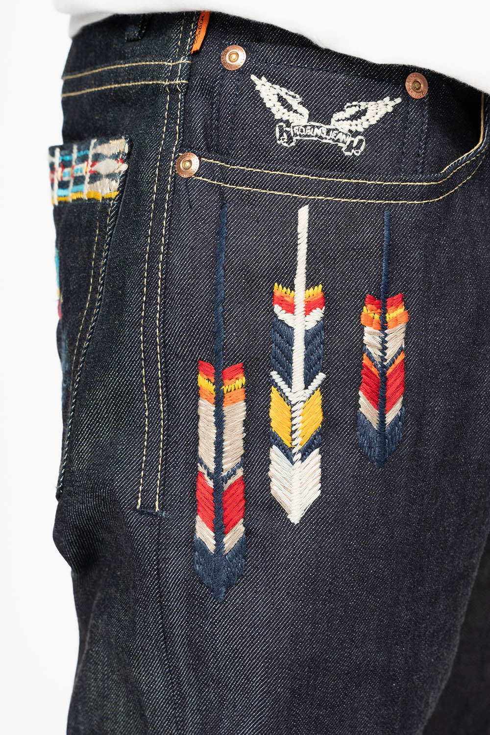 ROBIN’S INDIAN BONE STRIPE SLIM JEANS IN RAW DENIM EMBROIDERED INDIAN TRIBE MOTIF