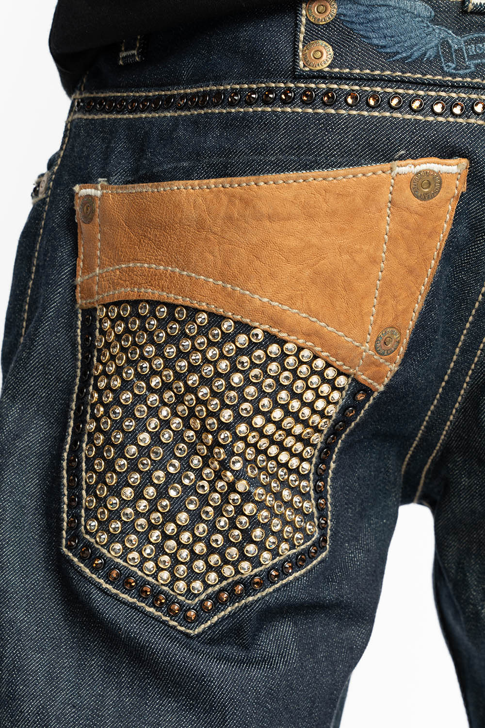 ROBIN’S BOOT CUT WESTERN JEAN  IN RAW DENIM WITH COGNAC LEATHER INSERTS EMBELLISHED WITH CRYSTALS