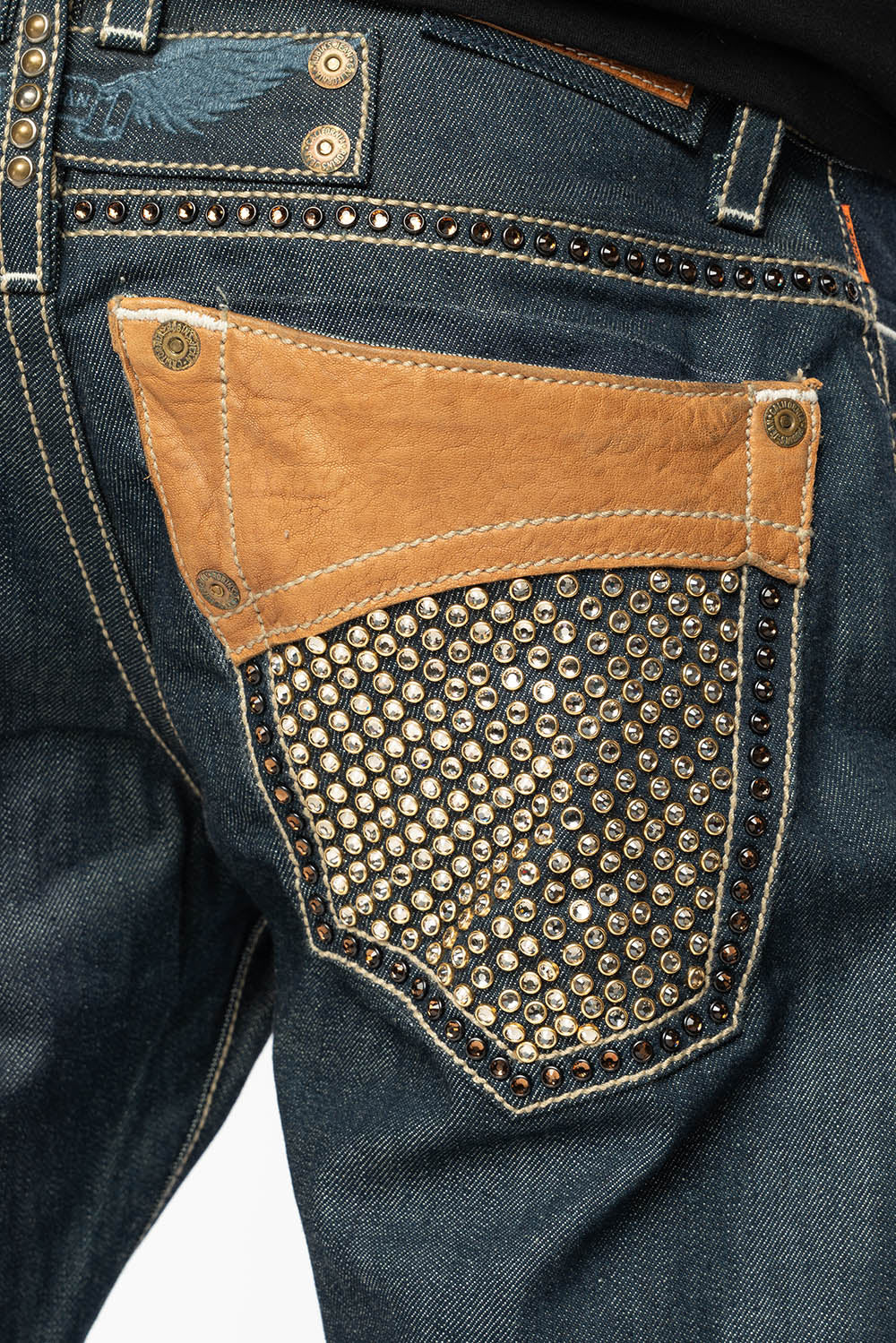 ROBIN’S BOOT CUT WESTERN JEAN  IN RAW DENIM WITH COGNAC LEATHER INSERTS EMBELLISHED WITH CRYSTALS