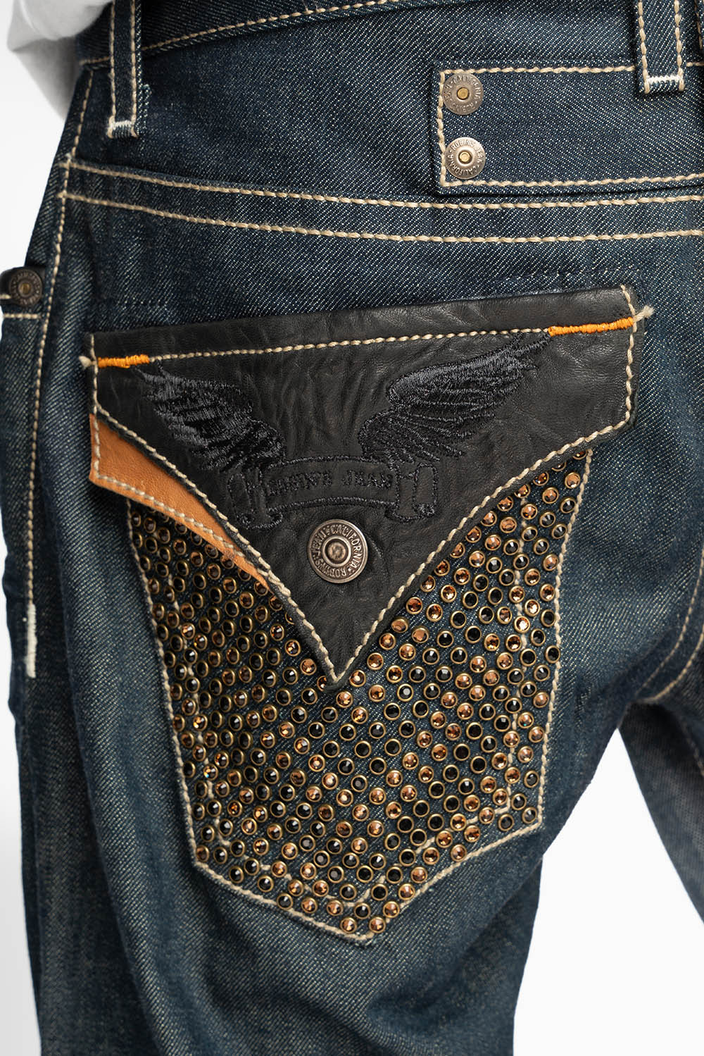ROBIN’S RYDER SHORT IN BLUE RAW DENIM WITH LEATHER FLAPS AND CRYSTALS