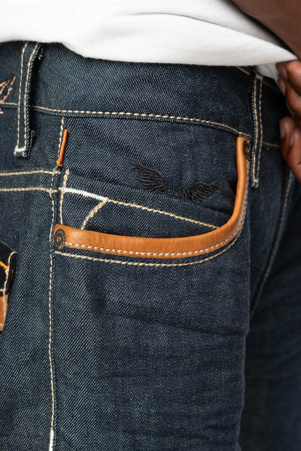 ROBIN’S RYDER SHORT IN BLUE RAW DENIM WITH LEATHER FLAPS AND CRYSTALS