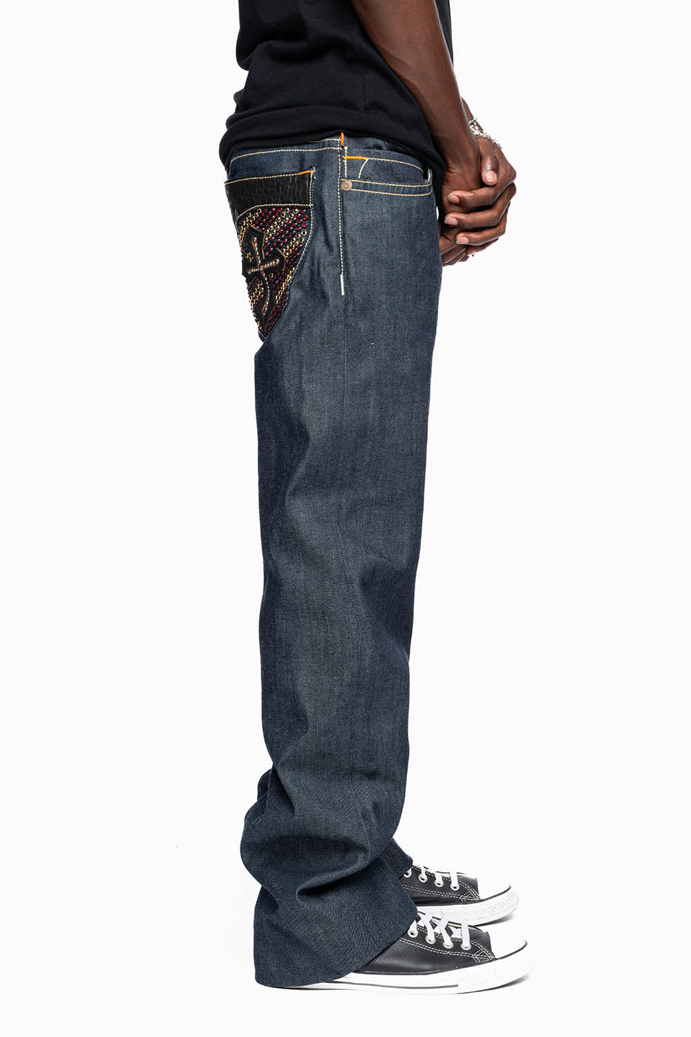 ROBIN’S BOOT CUT GOTHIC JEAN  IN RAW DENIM WITH BLK LEATHER  GOTHIC CROSS FULLY  EMBELLISHED WITH CRYSTALS
