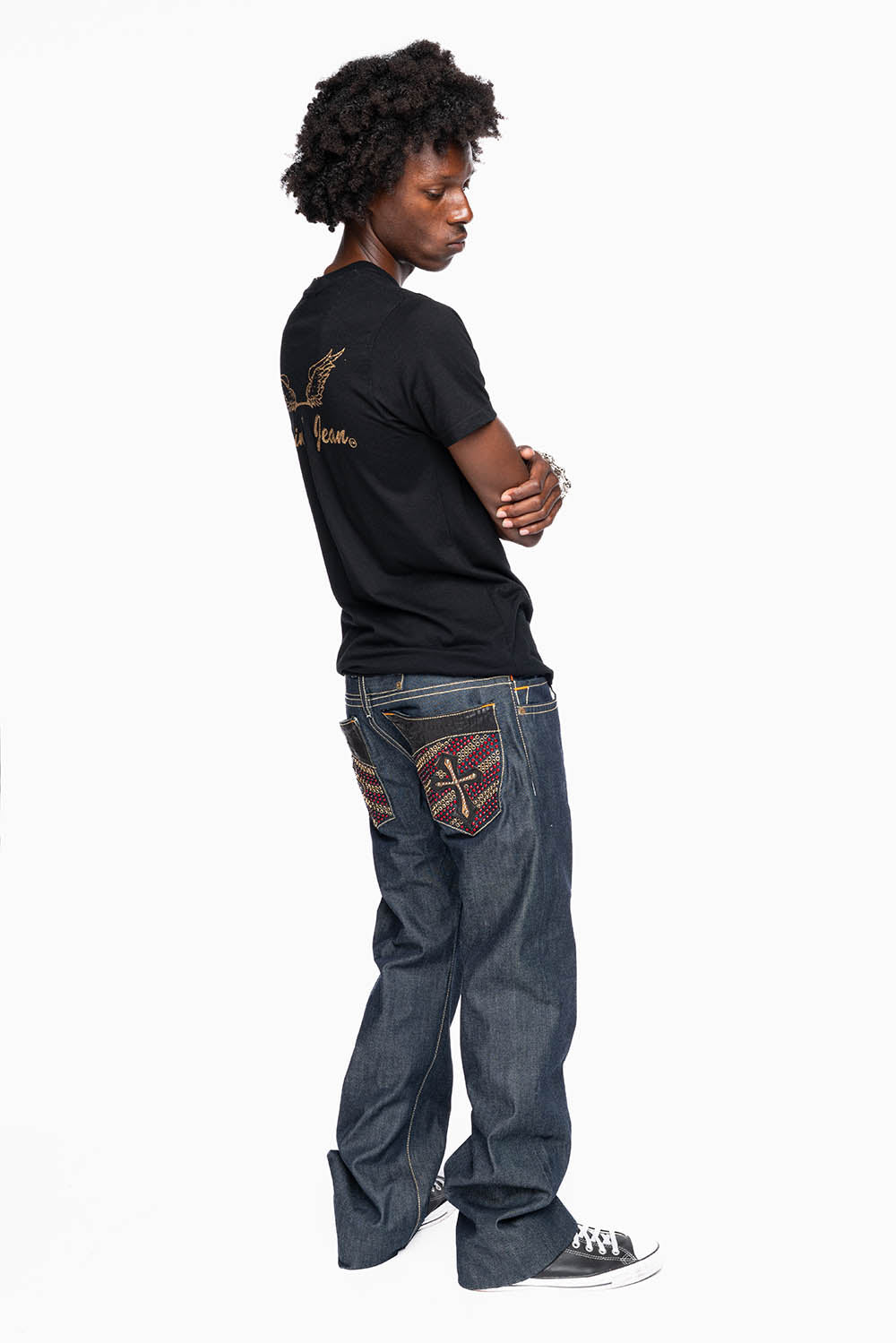 ROBIN’S BOOT CUT GOTHIC JEAN  IN RAW DENIM WITH BLK LEATHER  GOTHIC CROSS FULLY  EMBELLISHED WITH CRYSTALS