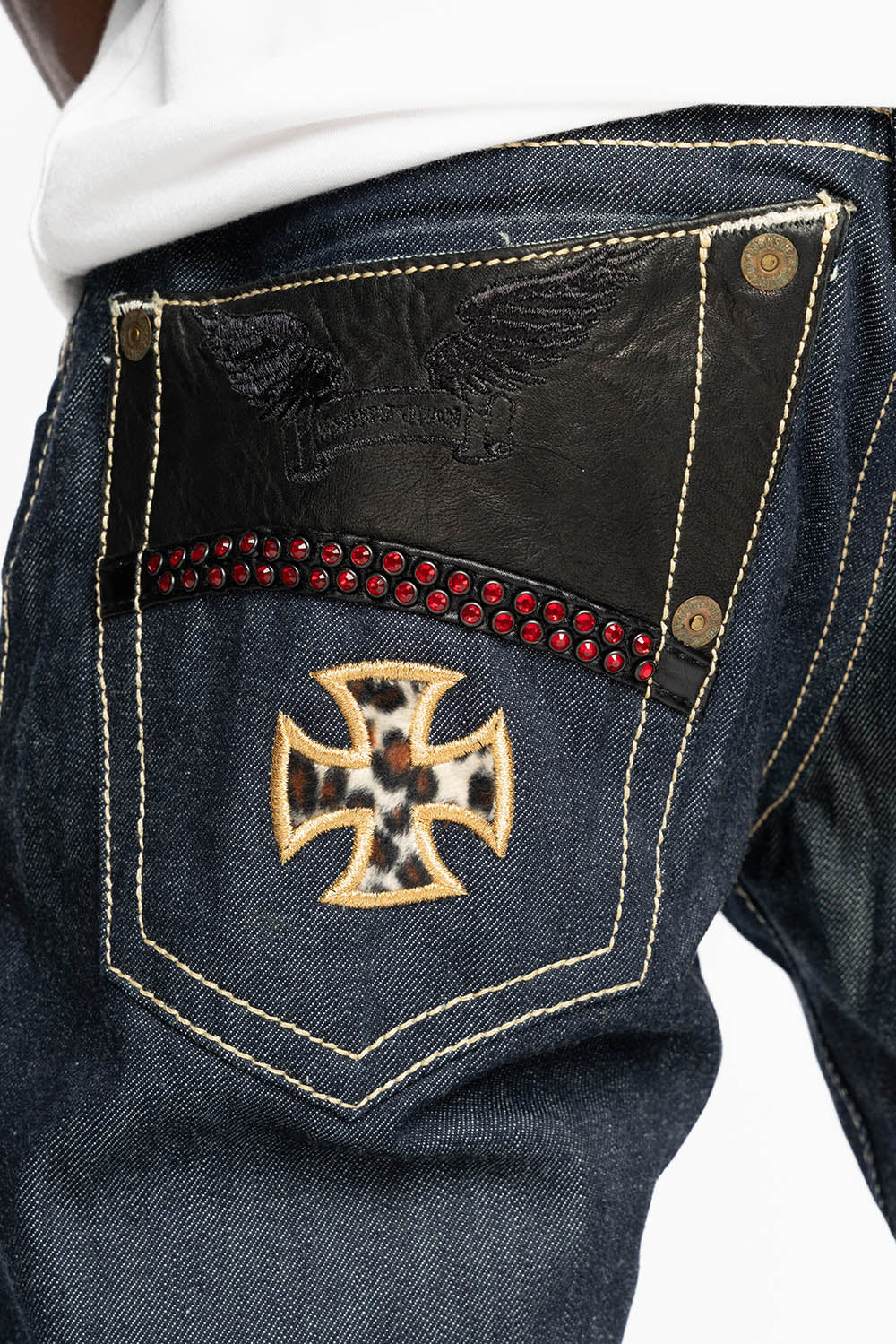 BONNEVILLE  JEAN W/BLK LEATHER IN RAW DENIM WITH CROSS AND EMBELLISHED WITH RED CRYSTALS