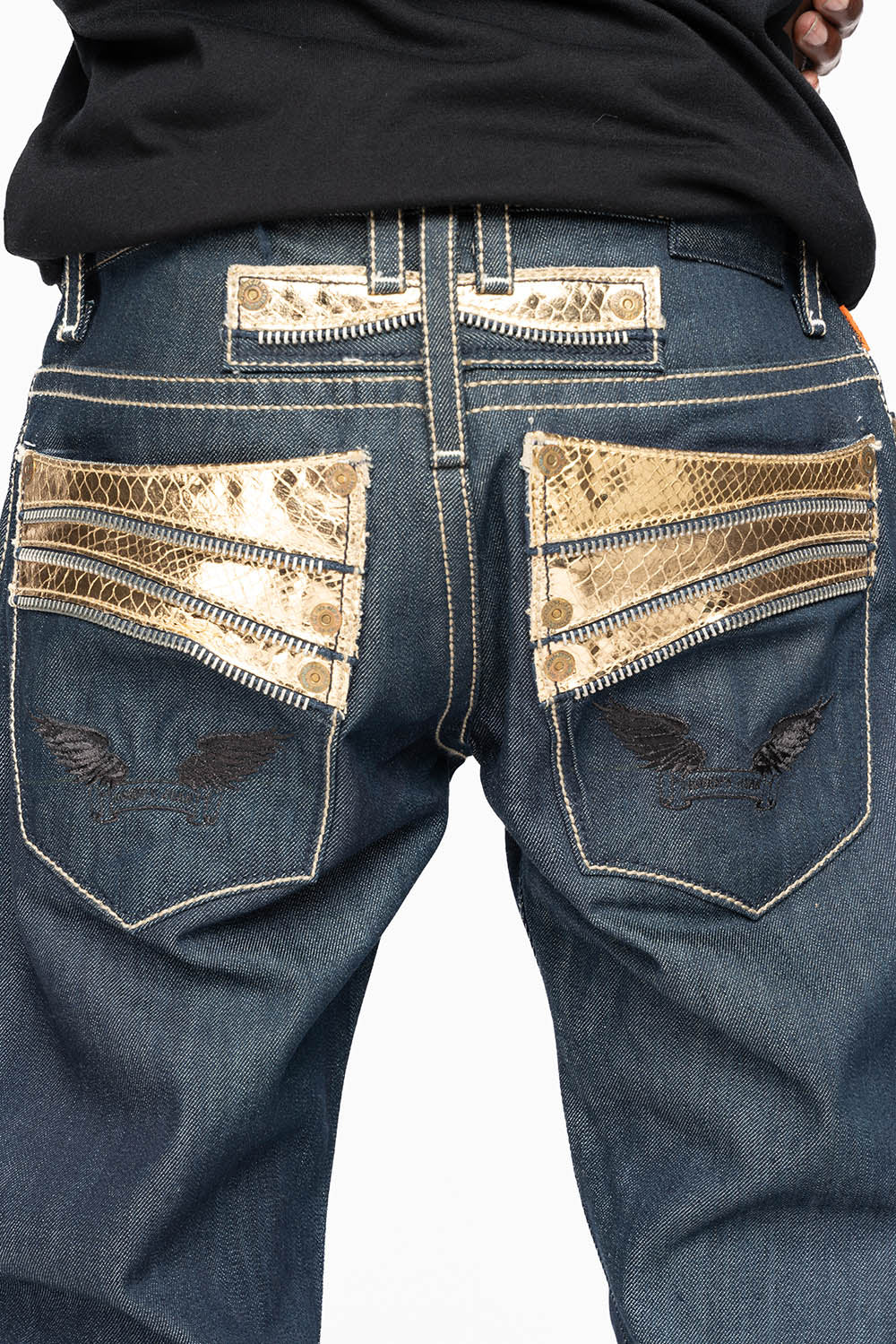 BOOT CUT JEAN  IN RAW DENIM WITH  GOLD LEATHER ZIPPER  EMBELLISHMENT ON BACK POCKETS