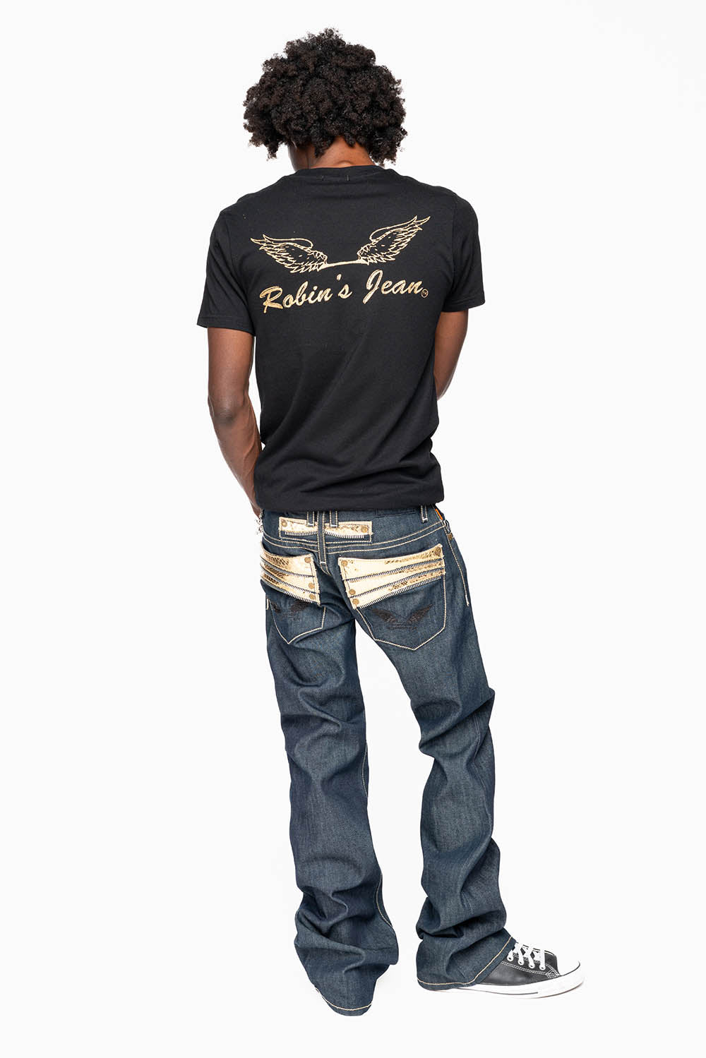 BOOT CUT JEAN  IN RAW DENIM WITH  GOLD LEATHER ZIPPER  EMBELLISHMENT ON BACK POCKETS