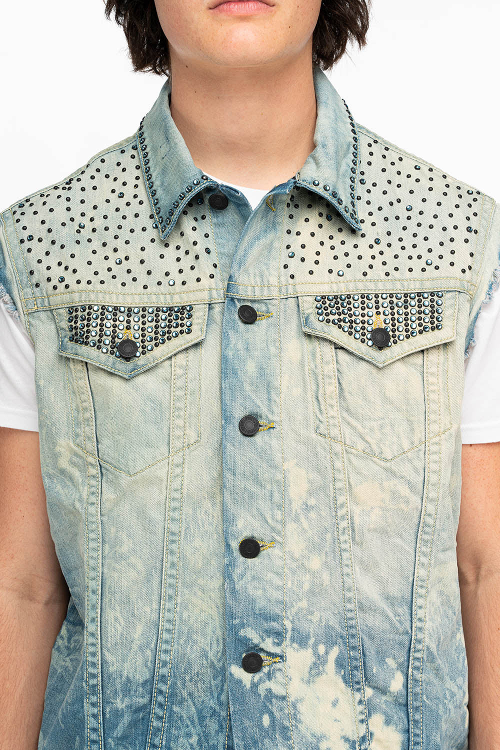 RAW EDGE VEST IN MEDIUM WASH WITH BLACK CRYSTALS