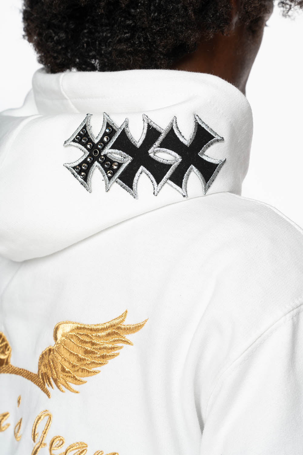 ROBIN’S JEAN PULLOVER HOODIE IN WHITE EMBELLISHED  WITH MEDIEVAL CROSS PATCHES AND  CRYSTALS