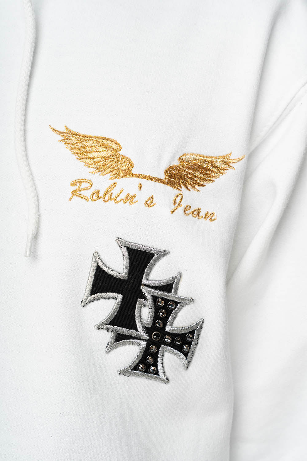 ROBIN’S JEAN PULLOVER HOODIE IN WHITE EMBELLISHED  WITH MEDIEVAL CROSS PATCHES AND  CRYSTALS