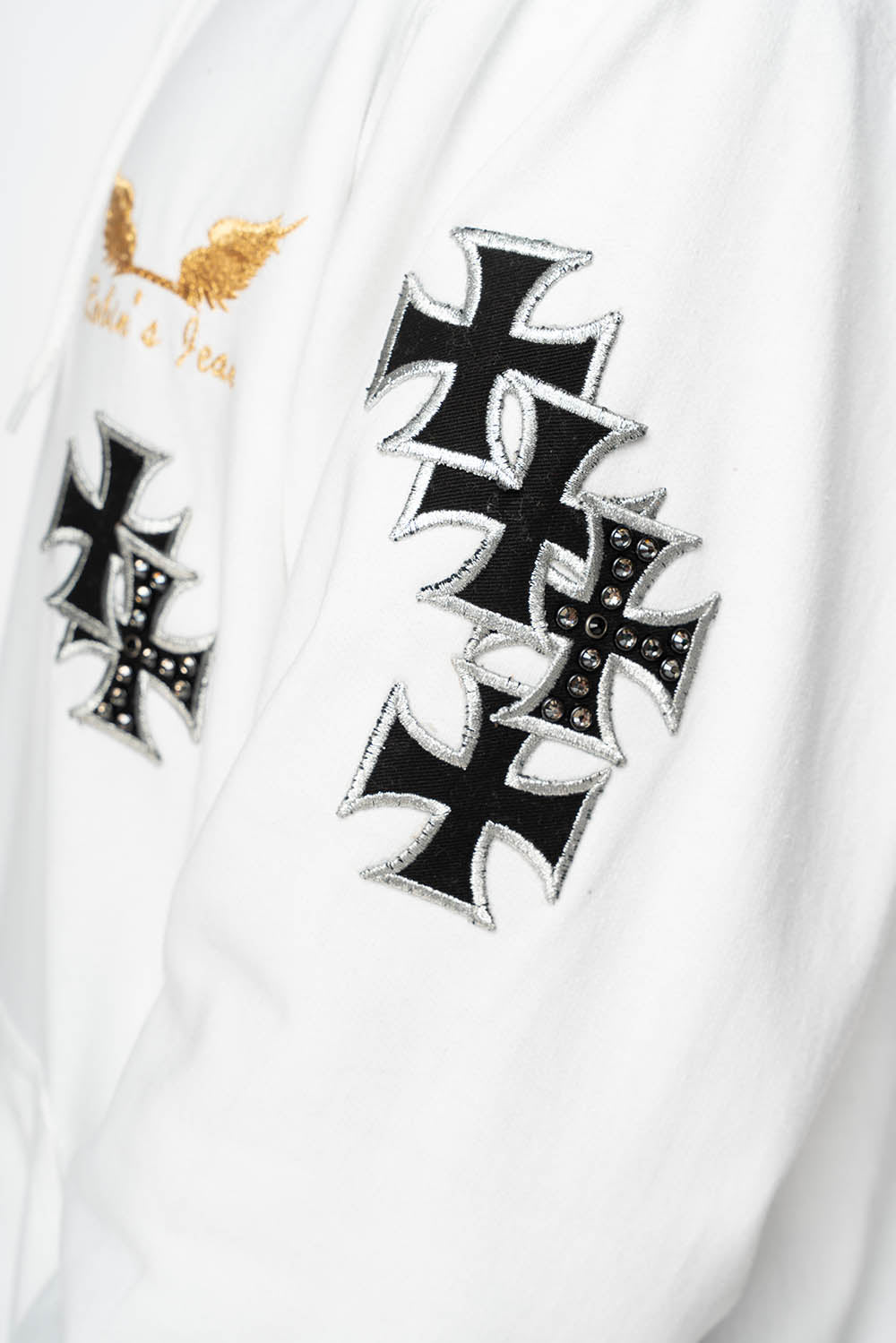ROBIN’S JEAN PULLOVER HOODIE IN WHITE EMBELLISHED  WITH MEDIEVAL CROSS PATCHES AND  CRYSTALS