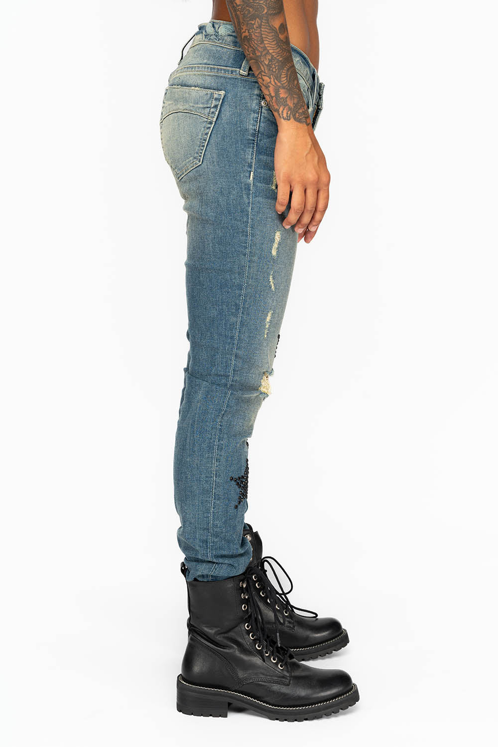 MIDRISE WOMENS SKINNY JEANS IN RIPPED BLUE WASH WITH JET BLACK CRYSTAL STARS