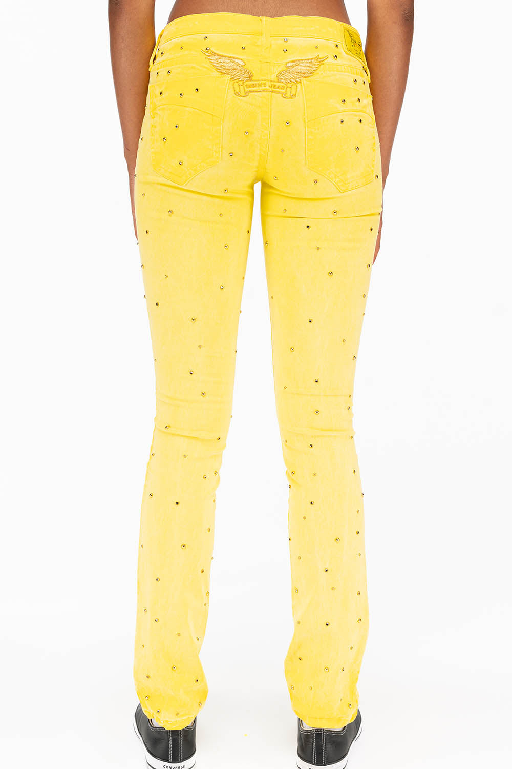 MARILYN LOW RISE WOMENS STUDDED STRAIGHT LOW RISE JEANS IN OIL YELLOW WITH TONAL WINGS AND CRYSTALS