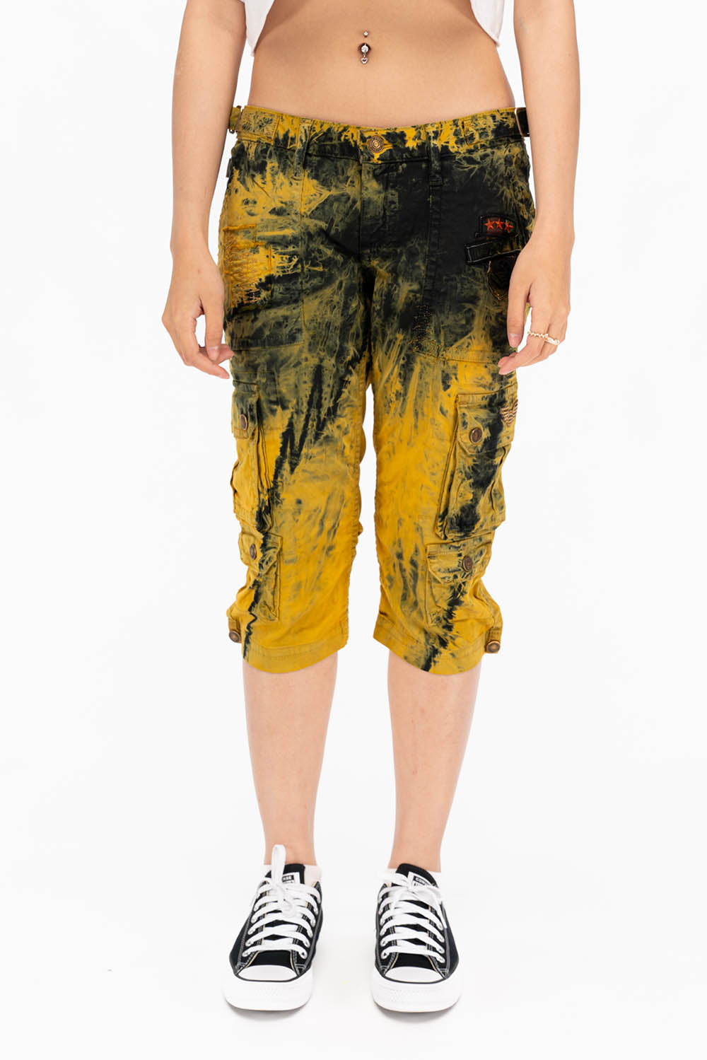 MILITARY STYLE ASSORTED PATCH WOMENS CARGO SHORTS IN TYE DYE YELLOW AND BLACK WASH