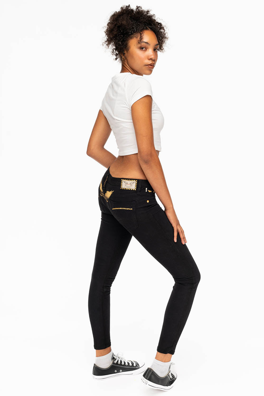 MARILYN LOW RISE WOMENS STUDDED SKINNY JEANS IN BLACK WITH GOLD WINGS AND GOLD CRYSTALS