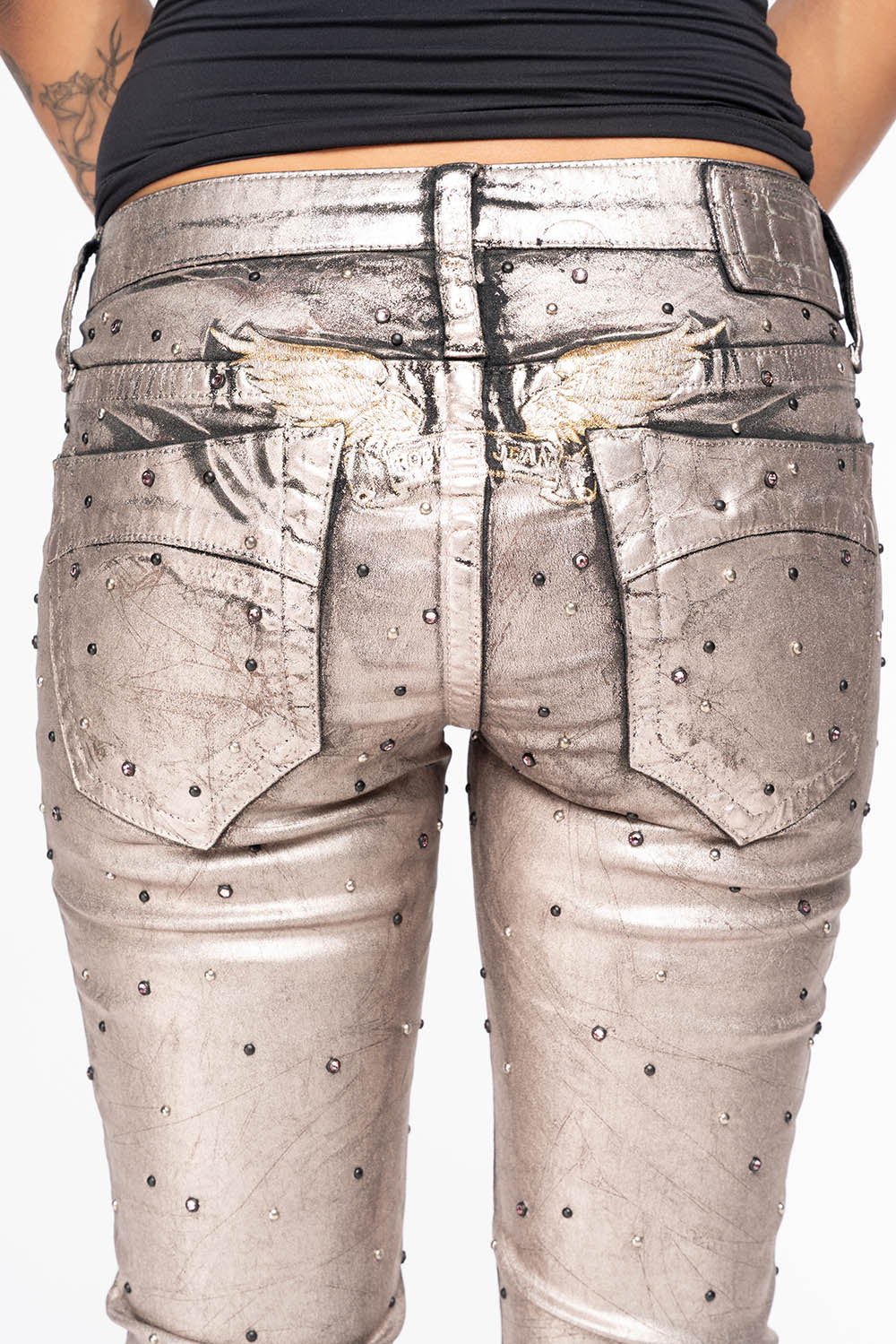 MARILYN WOMENS SKINNY JEANS IN SUN RISE GOLD COATING  WITH TONAL WINGS EMBELLISHED WITH CRYSTALS & STUDS