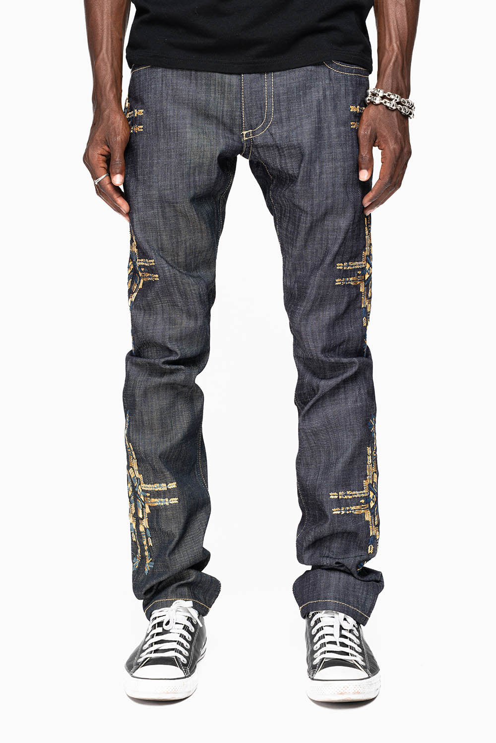 ROBIN’S MEN  SLIM JEAN IN CHAPA GOLD INDIGO RAW DENIM WITH GOLD WING AND CHAPA EMBROIDERY