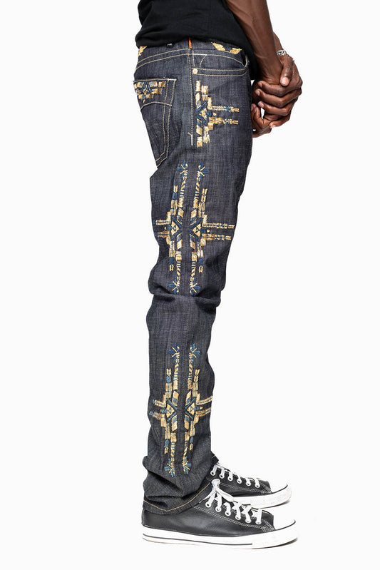 ROBIN’S MEN  SLIM JEAN IN CHAPA GOLD INDIGO RAW DENIM WITH GOLD WING AND CHAPA EMBROIDERY