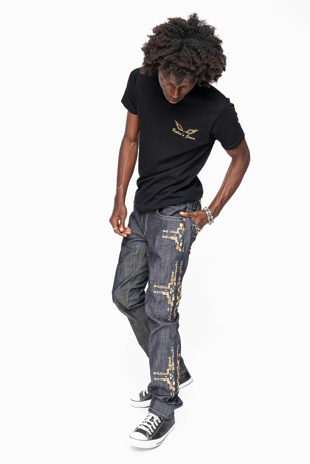 ROBIN’S MEN  SLIM JEAN IN CHAPA GOLD INDIGO RAW DENIM WITH GOLD WING AND CHAPA EMBROIDERY