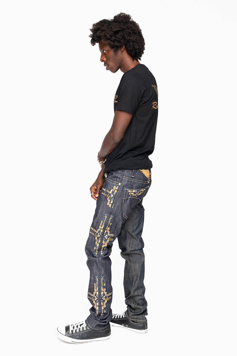ROBIN’S MEN  SLIM JEAN IN CHAPA GOLD INDIGO RAW DENIM WITH GOLD WING AND CHAPA EMBROIDERY