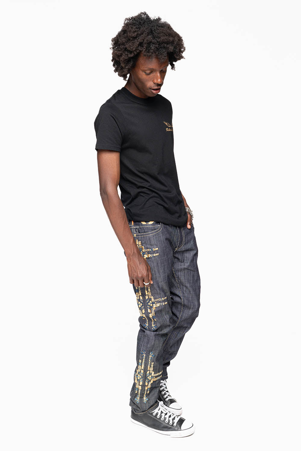 ROBIN’S MEN  SLIM JEAN IN CHAPA GOLD INDIGO RAW DENIM WITH GOLD WING AND CHAPA EMBROIDERY
