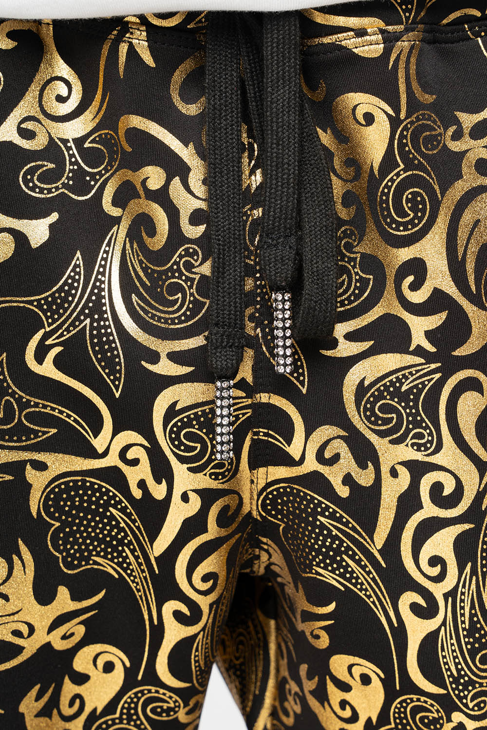 CLOUD JOGGER IN GOLD/BLACK PRINT EMBELLISHED WITH LARGE CRYSTALS