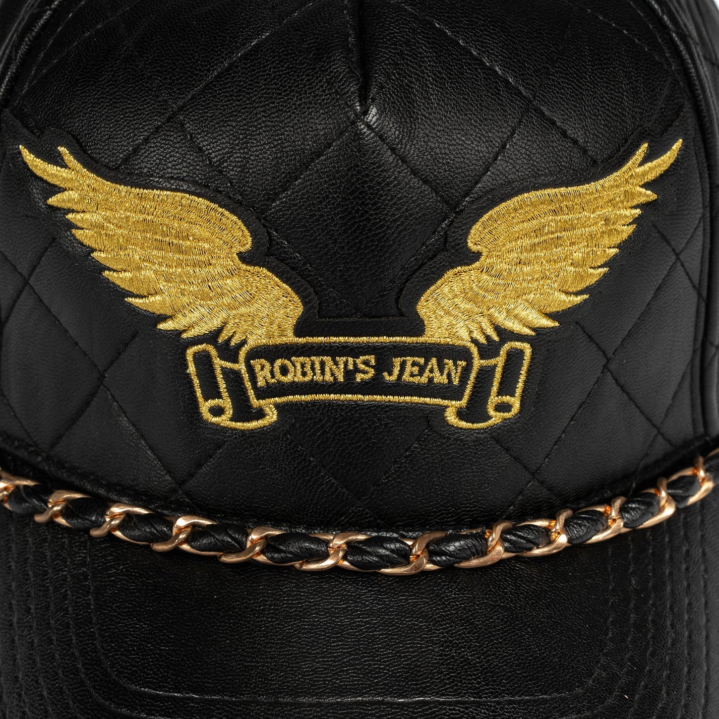 ROBINS LEATHER QUILTED CAP WITH GOLD WINGS STUDS AND COPPER CHAIN IN BLACK